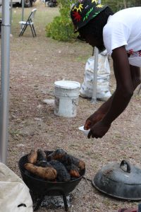 A vendor at the Bath Community Festival at Fort Charles on May 07, 2022, preparing roasted root crops for sale