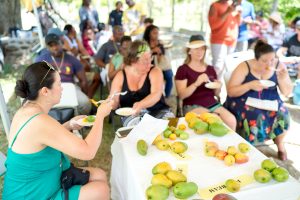 Travel agents among patrons at a mango sampling event at a Mango Festival on Nevis (photo provided)