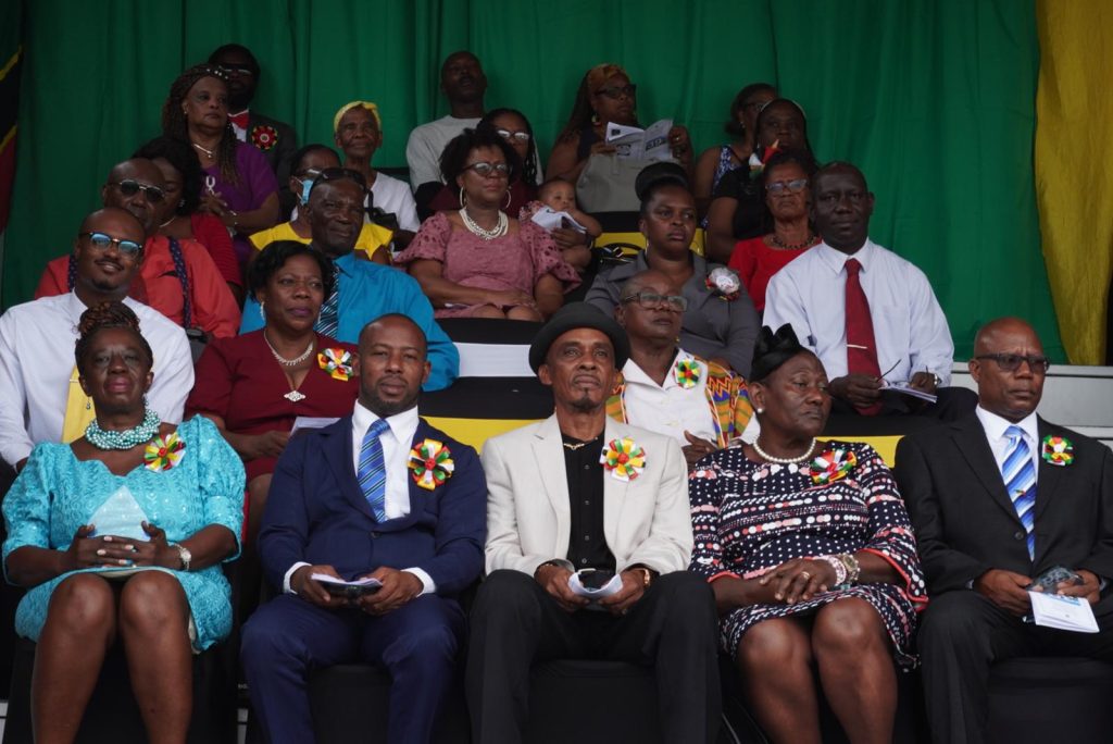 (First row L-r) Mrs. Ermileta Elliott; Mr. Steve Reid Jr. representing his father Mr. Steve Reid Sr.; Mr. Ulrick E. Morton; Mrs. Hyacinth Hendrickson; Mr. McLevon Tross (second row L-r) Mr. Phéon Jones representing his father Mr. Anthony Jones; Ms. Lorraine Archibald; and Ms. Eldaria Jones with their awards with other attendees at the 39th Anniversary Independence Day Ceremonial Parade & Awards Ceremony on September 19, 2022, at the Elquemedo T. Willett Park
