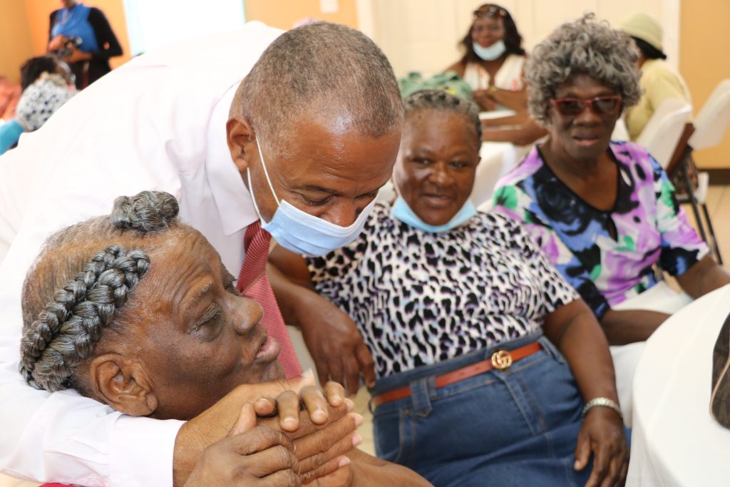 Ms. Hon. Eric Evelyn, Minister of Social Development on Nevis interacting with seniors from around Nevis at the resumption of the Seniors Recreational Group Meeting at the Jessups Community Centre on August 30, 2022