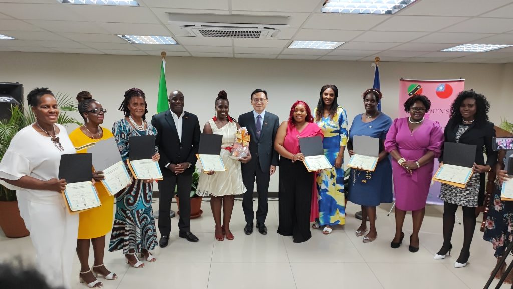 Seven of the eight awardees of the Microtrade Purchases and Sales Skills Training workshop with officials (l-r) Dr. Judy Nisbett; Mrs. Ermileta Elliott; Mrs. Althea Jones; Hon. Alexis Jeffers, Deputy Premier of Nevis; Mrs. Violet Clarke; His Excellency Michael Lin, Resident Ambassador of the Republic of China (Taiwan) to St. Kitts and Nevis; Ms. Monique Washington; Mrs. Angela Walters-Delpeche, Senior Business Development Officer at the Small Enterprise Development Unit; Ms. Joalyn Myers; Hon. Hazel Brandy-Williams, Jr. Minister of Gender Affairs; and Ms. Yunoka Flemming