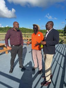 Mr. Huey Sargeant, Permanent Secretary in the Ministry of Agriculture (left) accompanying Hon. Samal Duggins, Federal Minister of Agriculture (right) on a tour of the Department of Agriculture’s Indian Castle Fruit Orchard on December 01, 2022, led by Mr. Ronald “Bankie” King, Farm Manager of the agricultural facility 