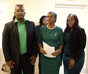 Dr. Janice Daniel-Hodge, Leader of the Nevis Reformation Party (NRP) (center)flanked by Mr. Ronald Powell of Fountain Village (left) and Ms. Corrine Hodge of Newcastle (right) on December 05, 2022