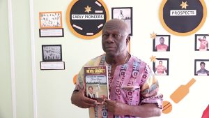 Mr. Stevenson Manners, local author and publisher of the book “The Father Son and Offsprings” documenting 78 years of Nevis’ cricketing history speaking of his publication at a recent exhibition at the Nevis Public Library in Charlestown