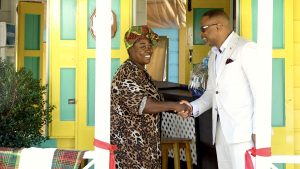 Hon. Mark Brantley, Premier of Nevis and Minister of Tourism moments after cutting the ribbon to officially open The Heritage Café congratulates proprietor Ms. Sofia Wallace, at 20th anniversary celebrations of the Nevisian Heritage Village on March 03, 2023
