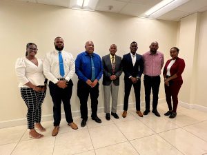 The delegation from St. Eustatius (l-r) Ms. Sabrina Richardson, Administrative employee at the Department of Agriculture; Mr. Vaughn Sams, Political Advisor to the Commissioner; Mr.  Derrick Simmons, Commissioner with the portfolio for Agriculture and Fisheries; Mr. Anthony Reid, Director of Economy, Nature and Infrastructure; and Ms. Sharon Veira, Manager of Unit Veterinary and Island Veterinary Officer with Hon. Eric Evelyn, Minister of Agriculture and Deputy Premier of Nevis (fourth from left) and; Mr. Huey Sargeant, Permanent Secretary in the Ministry of Agriculture on Nevis, following their meeting at Pinney’s Estate on March 30, 2023