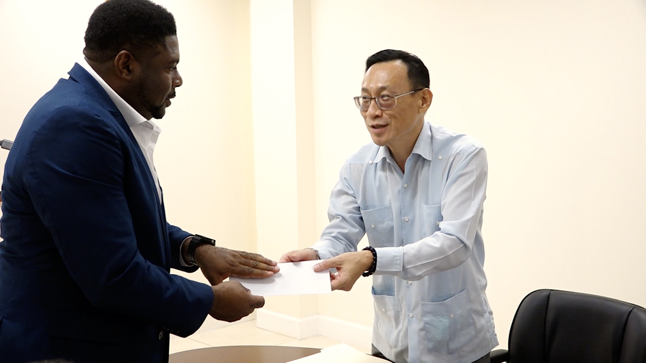 The Republic of China (Taiwan) Resident Ambassador to St. Kitts and Nevis, His Excellency Michael Lin presents a US$15,000 cheque for the STEM programme to Hon. Troy Liburd, Minister of Education in the Nevis Island Administration recently at Pinney’s Estate