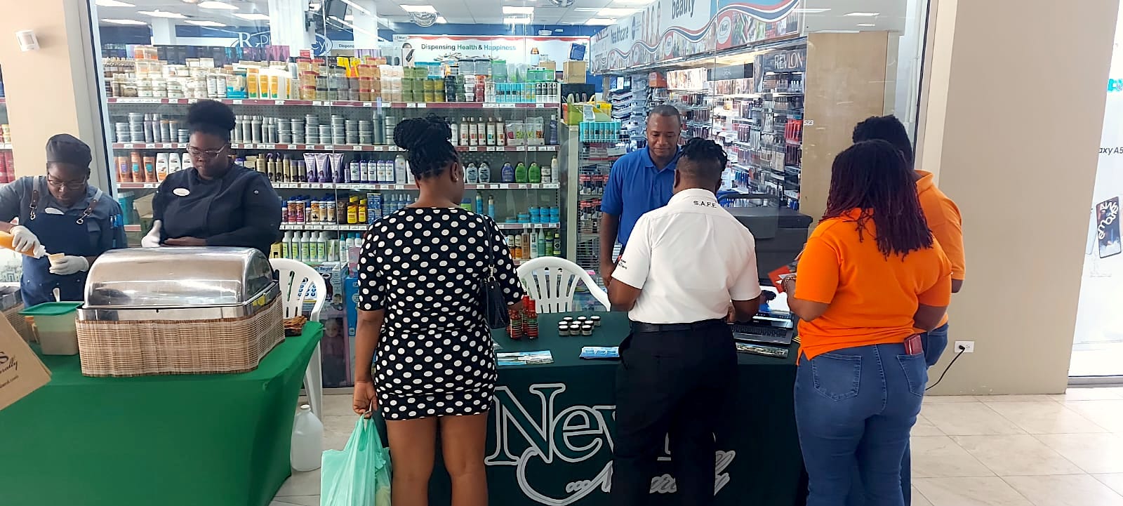 Mr. Alexis Arthurton, Caribbean Sales Manager at the Nevis Tourism Authority interacting with members of the public at the Sheraton Mall in Barbados on May 12, 2023