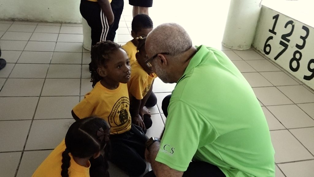 Dr. Didacus Jules, Director General of the Organisation of Eastern Caribbean States interacting with students of the Elizabeth Pemberton Primary School at an OECS in the Classroom on June 14, 2023, as part of the activities marking the organisation’s 42nd anniversary in St. Kitts and Nevis